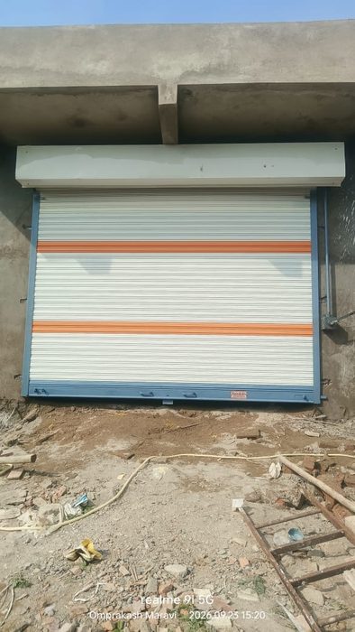 Single gear rolling shutter with orange stripe, new construction site, Nagpur